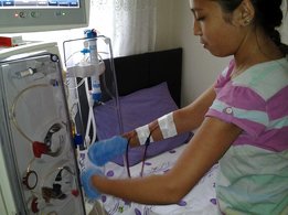 Girl with dialysis machine