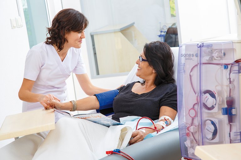 Nurse and patient during dialysis treatment