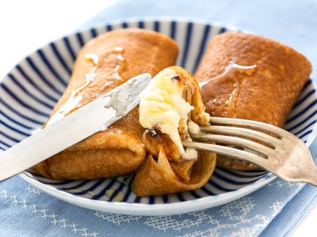 Stuffed pancakes with cheese and honey