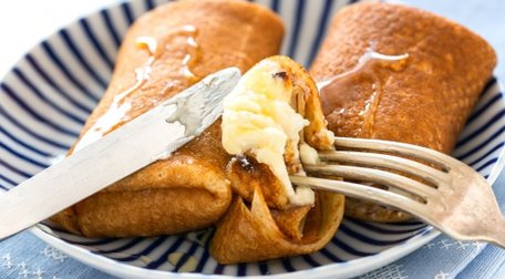 Stuffed pancakes with cheese and honey